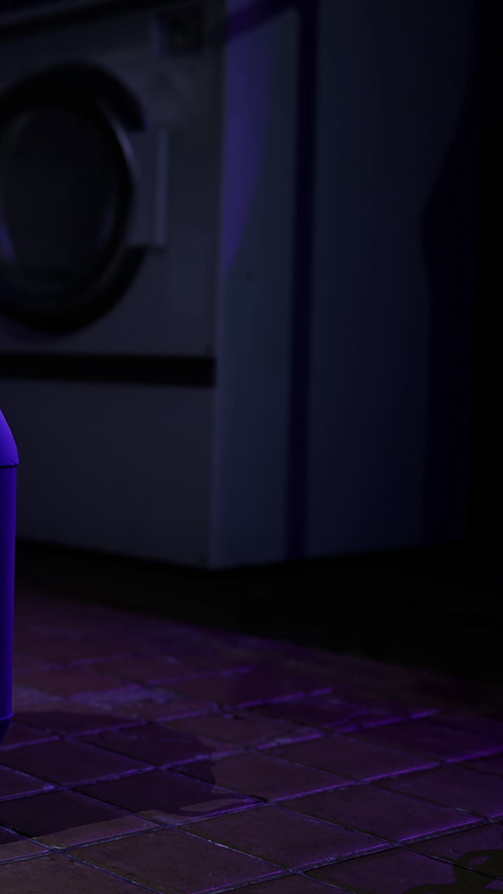 Lights illuminating the floor in a dark laundry room at night