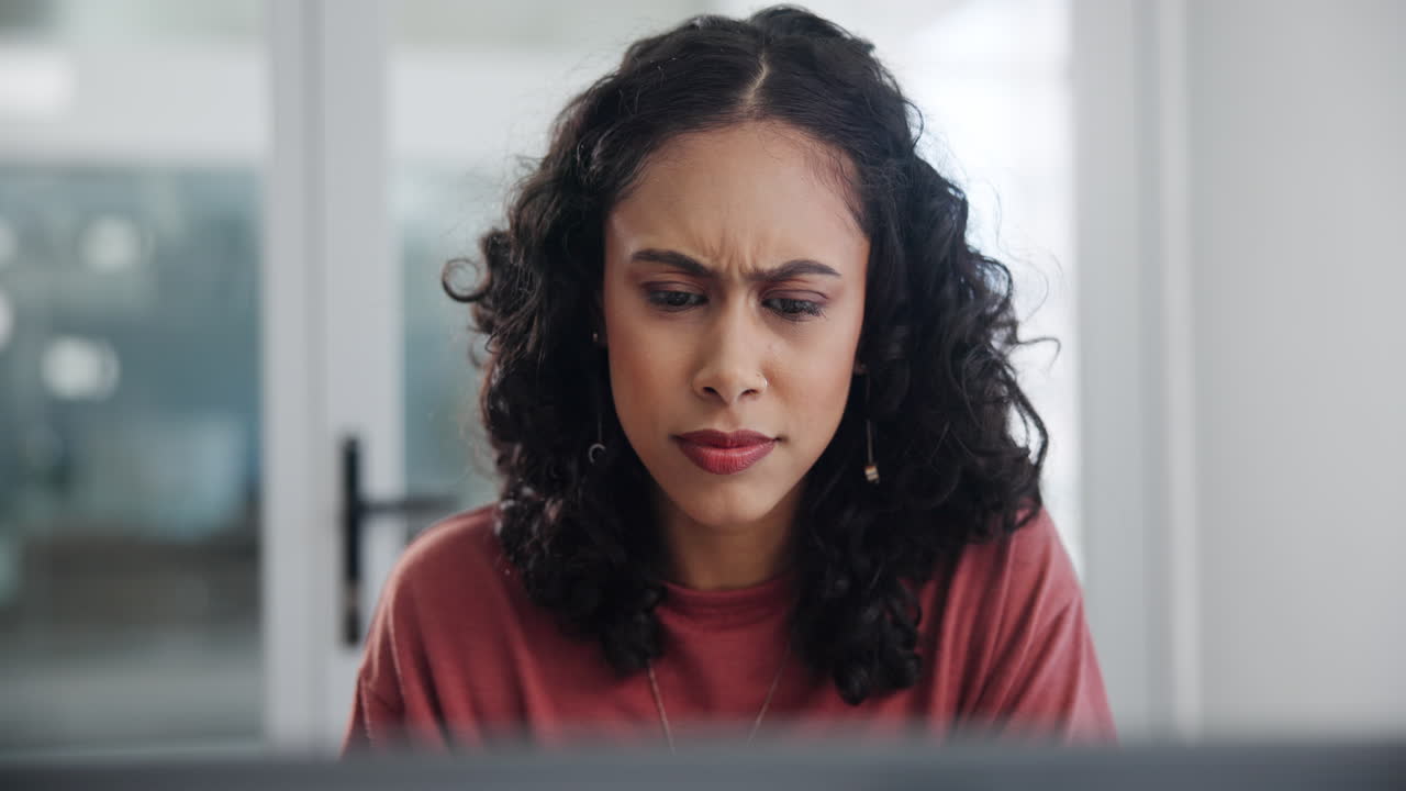 Woman Excitedly Looking at a Laptop