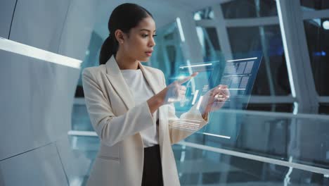 woman interacting with futuristic hologram