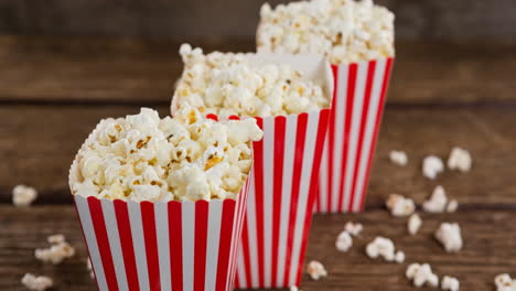 animation of boxes of popcorn over wooden table