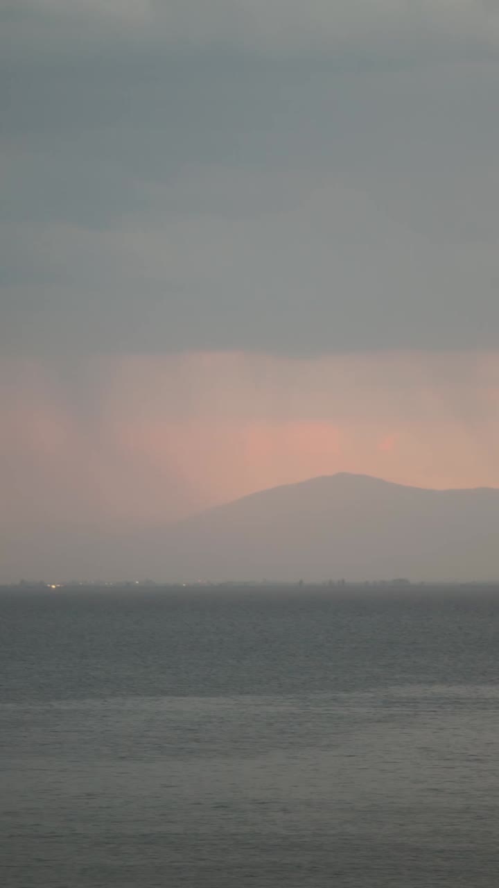Sea view at sunset with mountain in the background