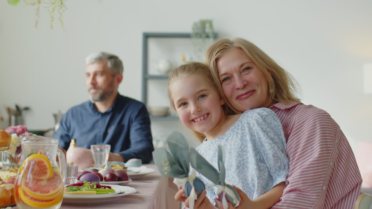Portrait of Happy Girl with Grandma on Easter Dinner