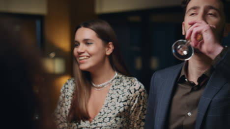 young people partying dancing in luxury restaurant. couple celebrating in cafe.