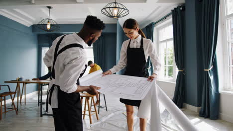 team reviewing construction plans in a modern office space