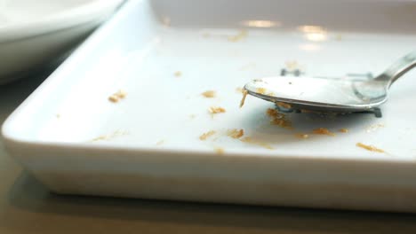 Empty-plate-after-eating-on-table-,