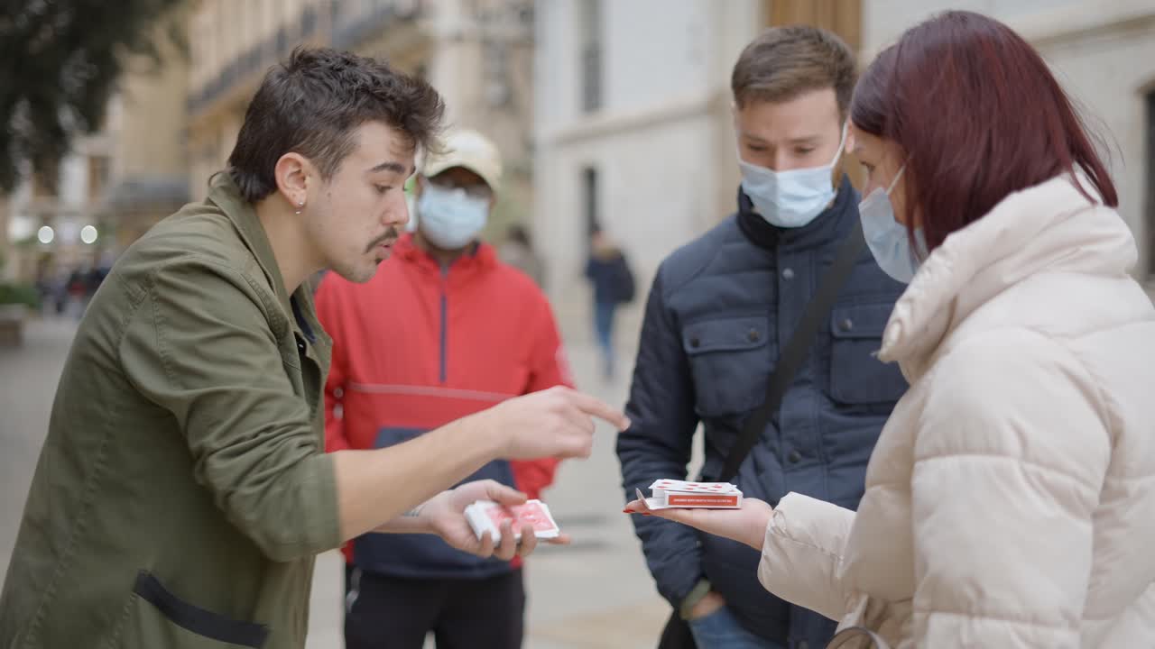 Street Magician Performing Card Trick