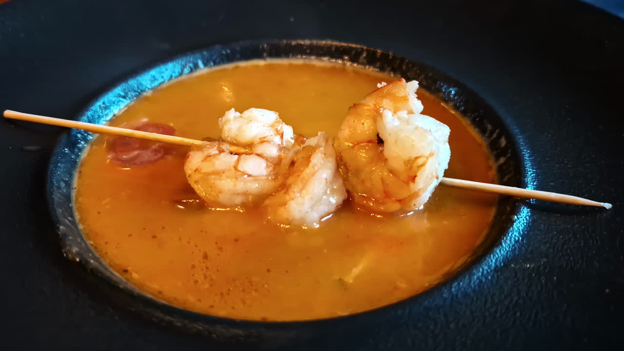Giant king prawn skewer over miso soup japanese dish cuisine seafood hot steaming