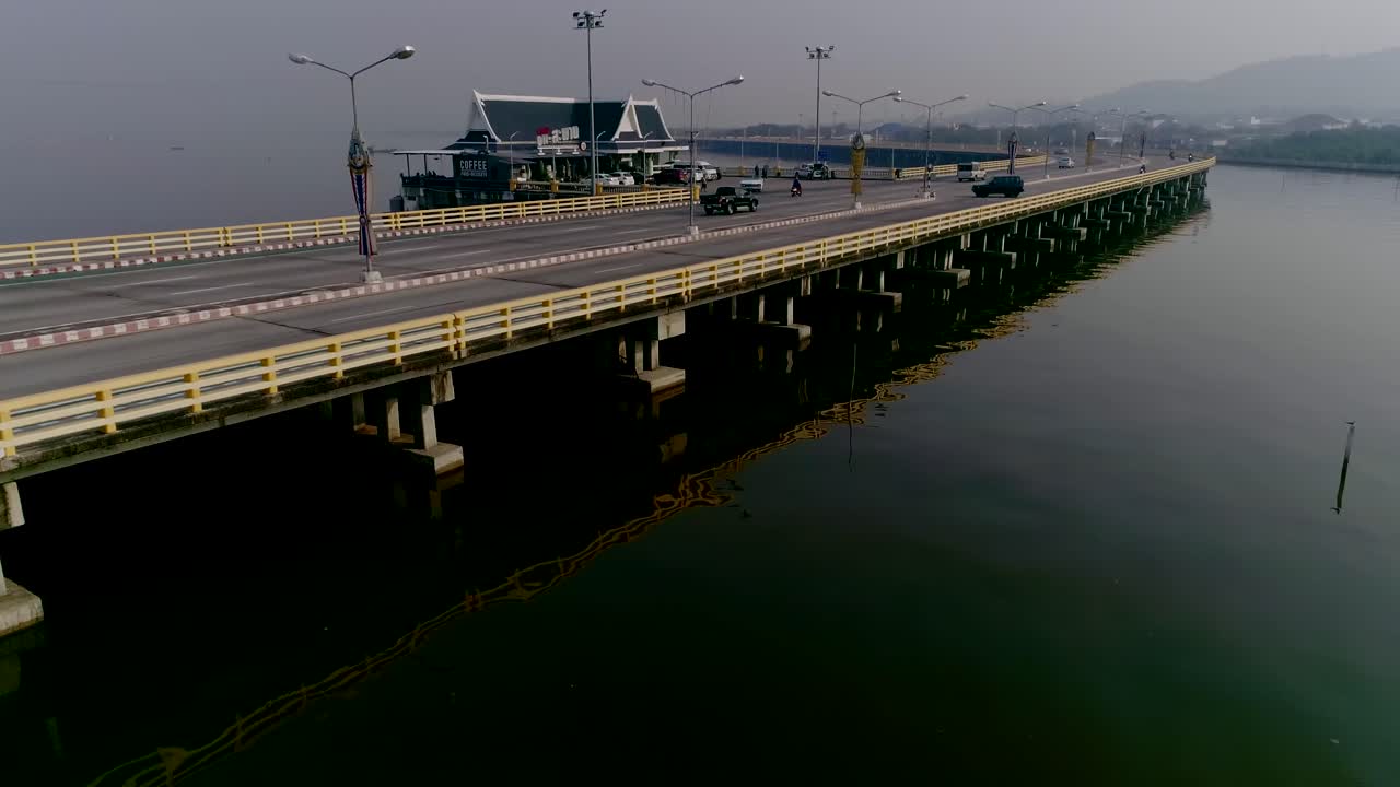 Aerial shot long highway by the sea , urban city in thaailand 4k 60fps