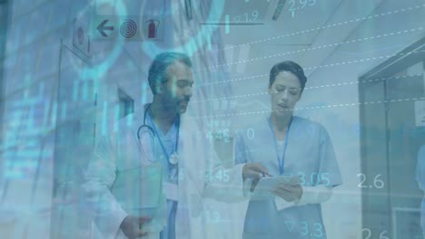 animation of stock market data processing over diverse male and female doctor discussing at hospital