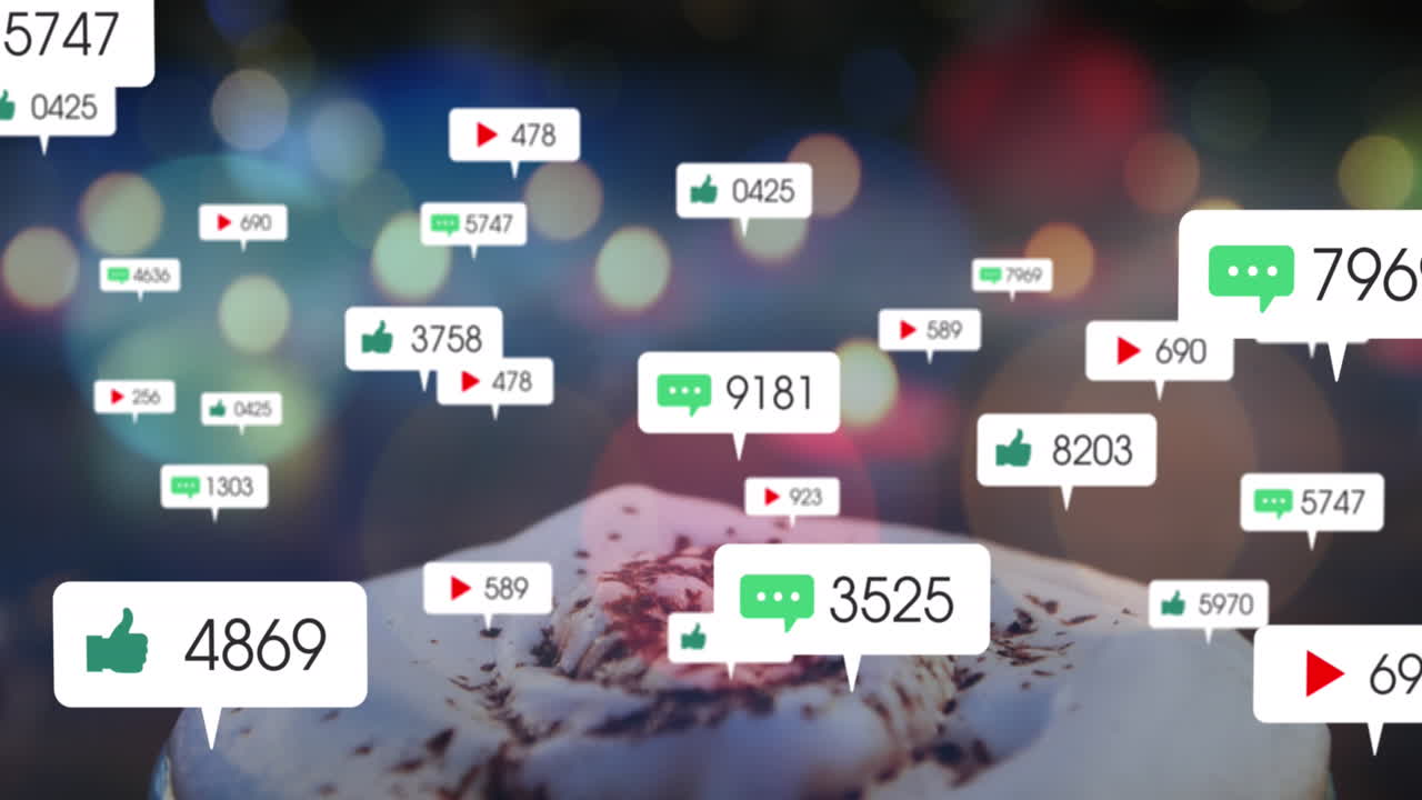 커피 컵의 클로즈업에 대한 다채로운 빛의 반점 위에 소셜 미디어 아이콘의 애니메이션