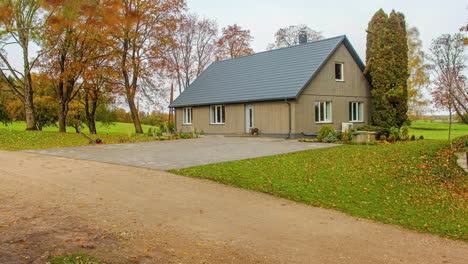 Time-lapse-of-detached,-countryside-house-construction-during-changing-seasons