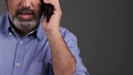 middle aged man receiving bad news on phone with copy space