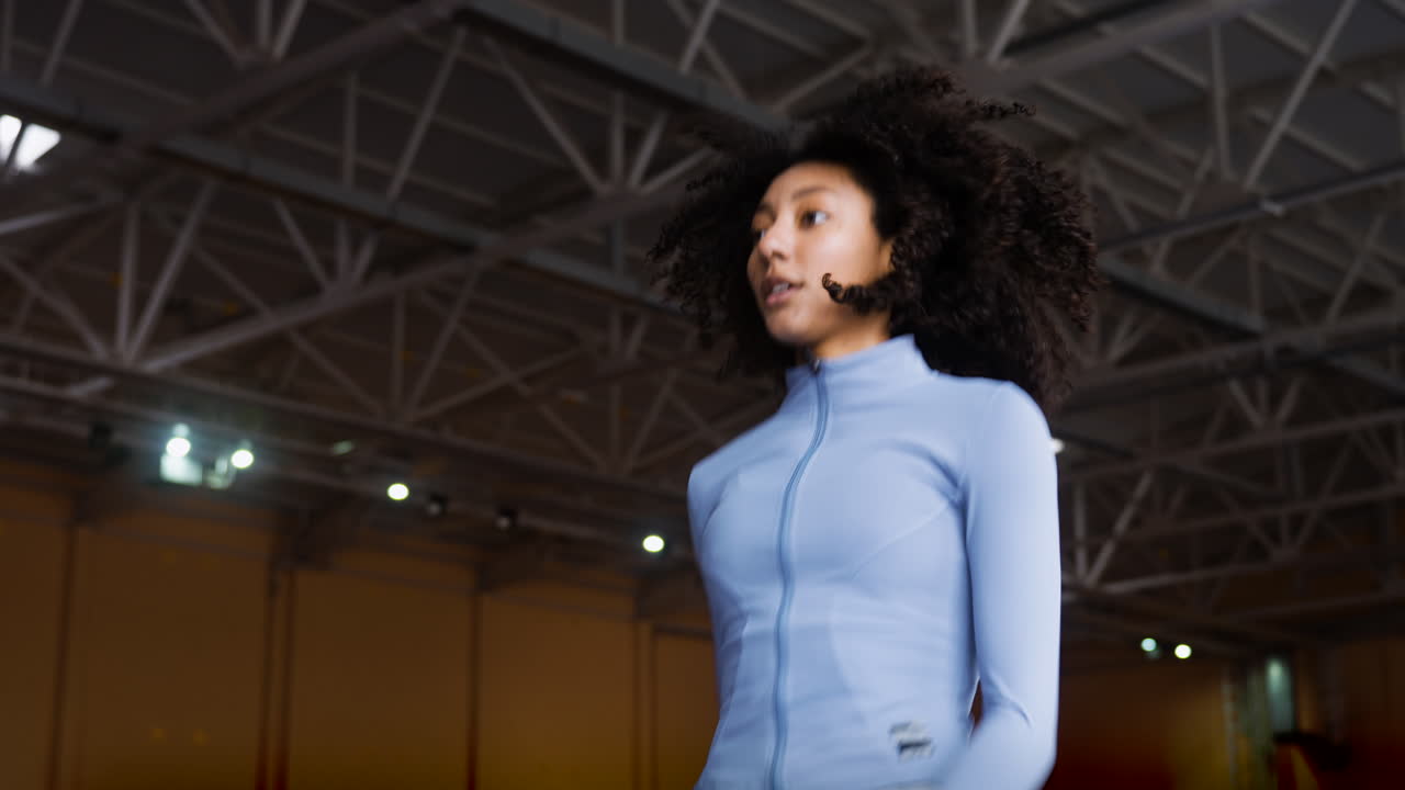 Woman warming up indoors