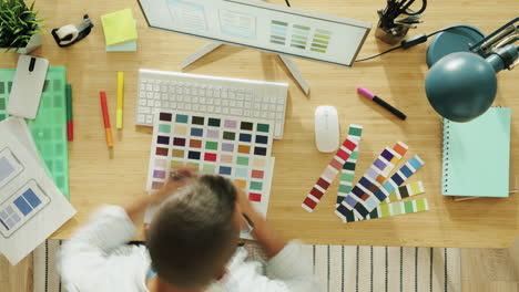 designer working on mobile app mockups