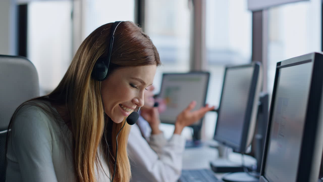 Smiling service operator work computer closeup. Friendly woman talking headset