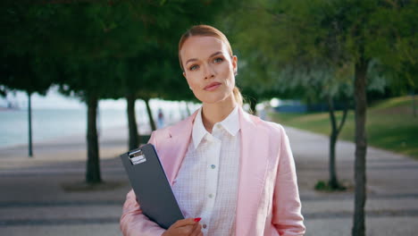 successful business woman standing at city alley closeup. portrait of lady boss.