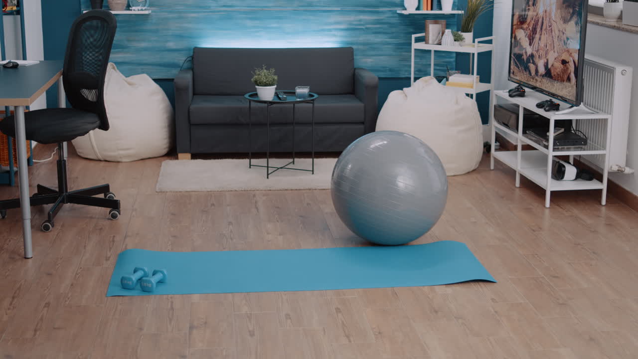 Nobody in living room with sport equipment to exercise