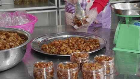 dong hop chanh vietnamese traditional food desert being serve by a woman in a packed presentation