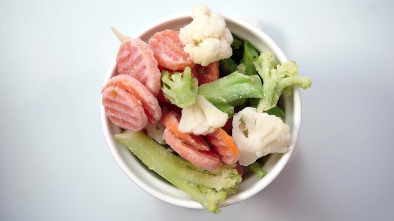 Colorful frozen vegetables in a bowl, fresh and nutritious food option