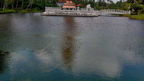gentle ripples across a calm lake reflecting the sky and subtle tree shadows in the water