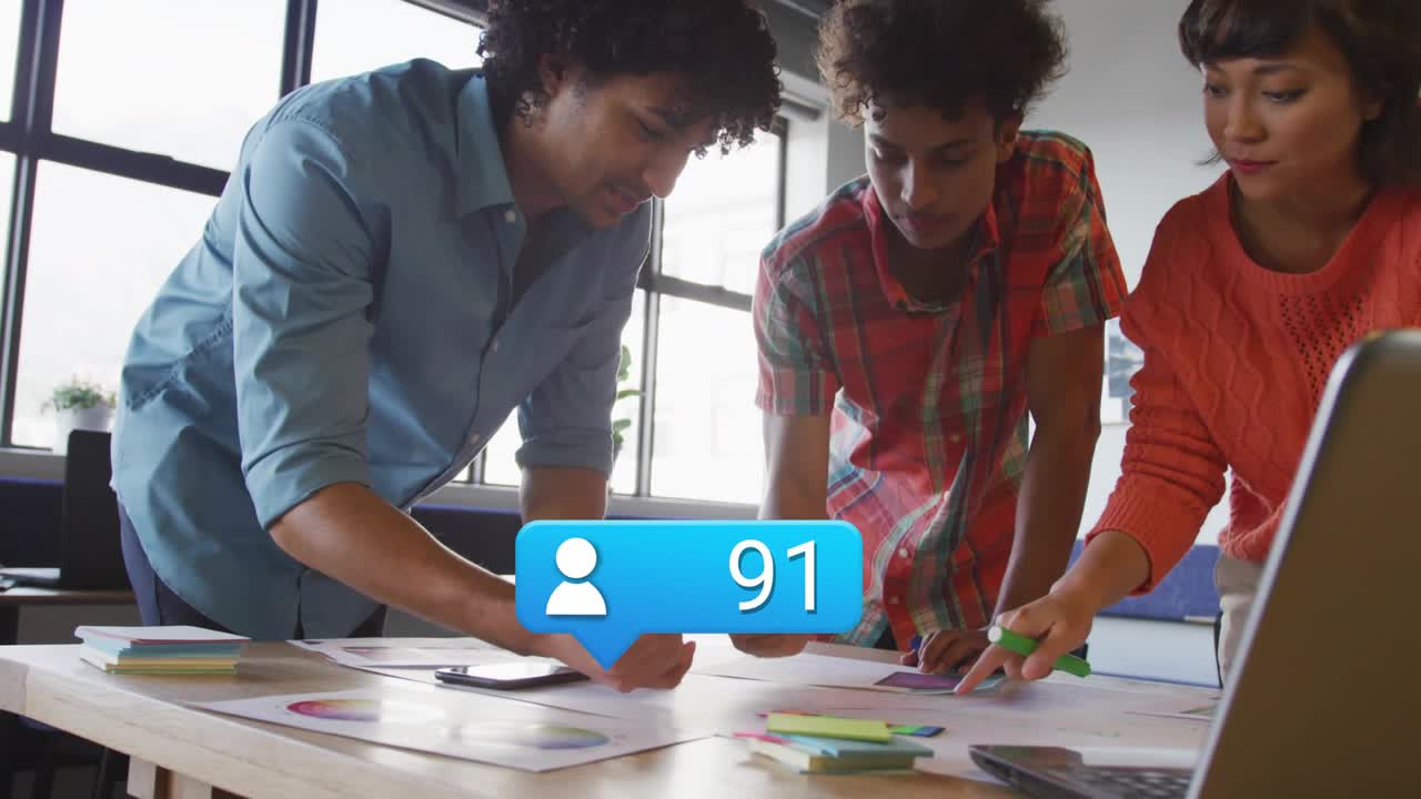 Team tapping smartphone, bubble displaying rising engagement count fueling marketing planning