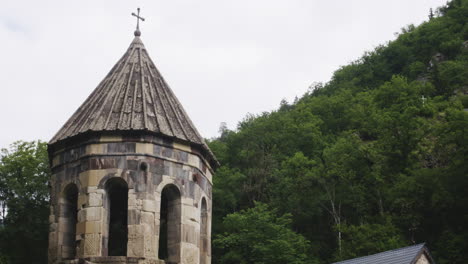 mtsvane monastery church bell tower with holy cross on top of steeple