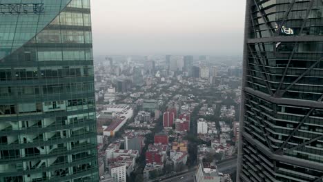 drone flying away from the skyscraper in mexico city