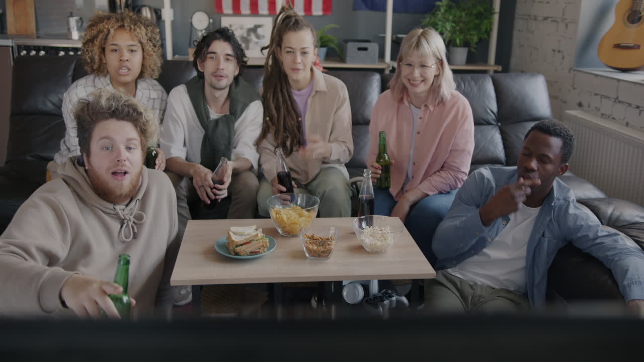 Friends Watching TV and Celebrating