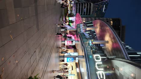 oue downtown, night view with shoppers