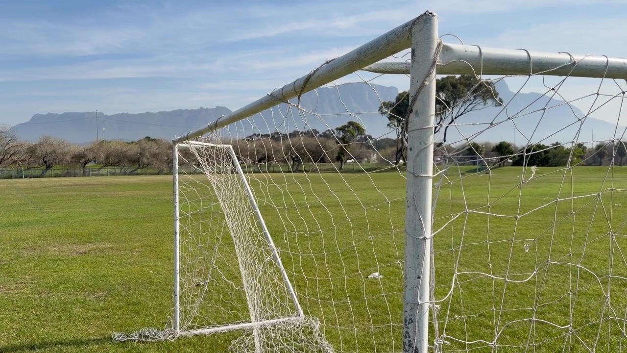 Football goals with nets on a football field.