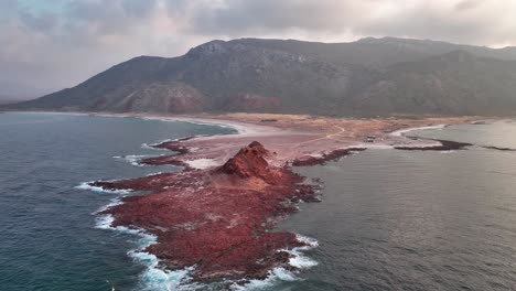 Dihamri-Beach-With-Red-Rocks-At-Sunset-In-Socotra,-Yemen---aerial-drone-shot