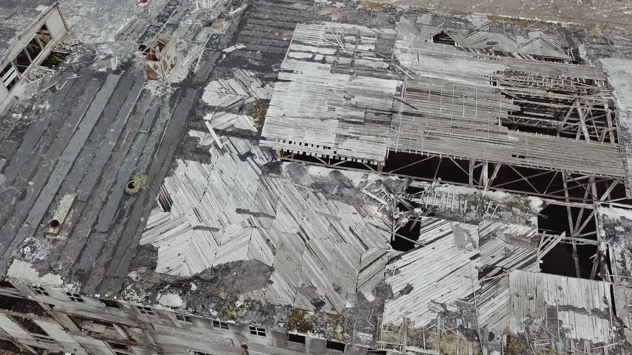 Flight over the destroyed factory. Old industrial building for demolition. Aerial view