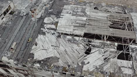 flight over the destroyed factory. old industrial building for demolition. aerial view