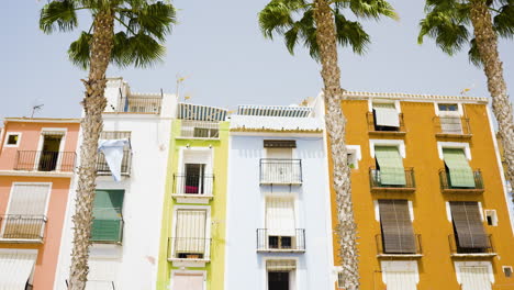 colorful mediterranean buildings with palm trees