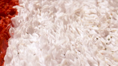 macro closeup dolly shot over of a red and white towel