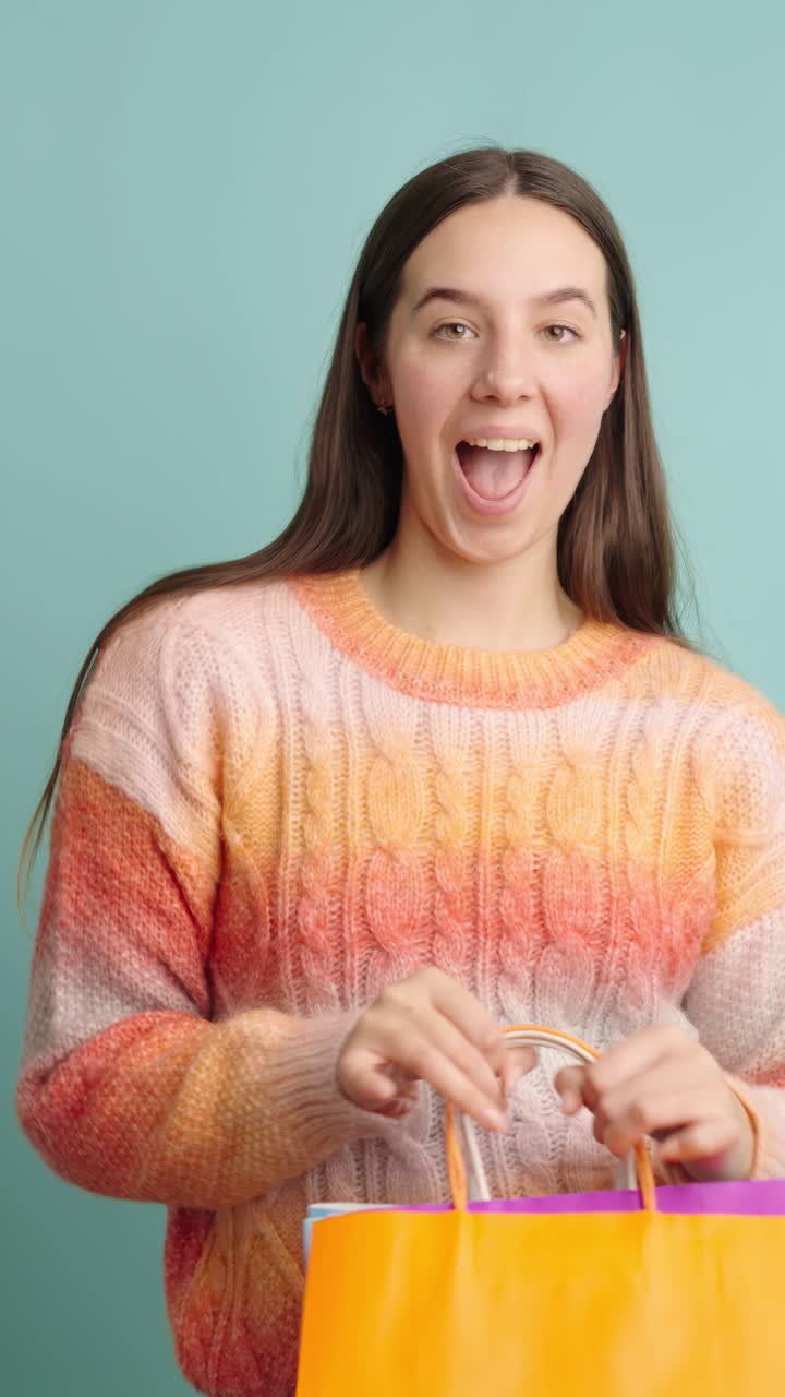 Young woman enjoying a fun shopping experience with bags