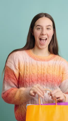 young woman enjoying a fun shopping experience with bags