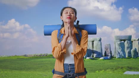Woman Praying at Stonehenge