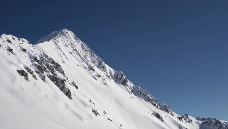 snow-capped mountain peak under a clear blue sky