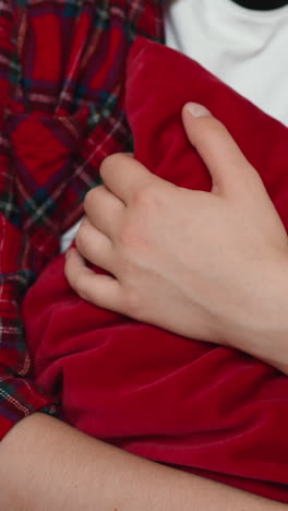 nervous woman hugs pillow on sofa closeup. lady with panic attack holds soft cushion handling with mental health issues. non verbal expression