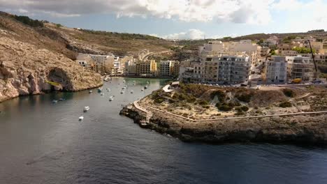 Tracking-drone-shot-of-Xlendi-Bay-in-Gozo