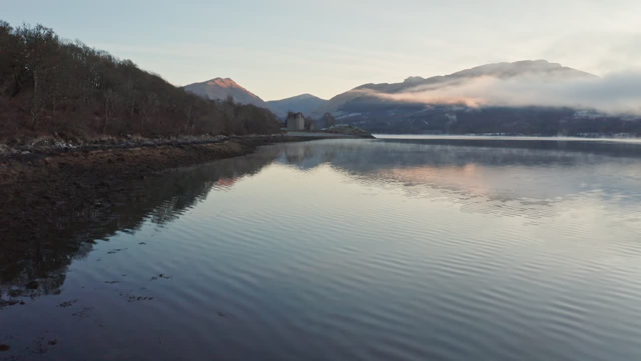 Distant View Of The Ancient Dunderave Castle on Northern Shores Of Loch Fyne In Argyll and Bute, Highlands of Scotland - Drone Shot