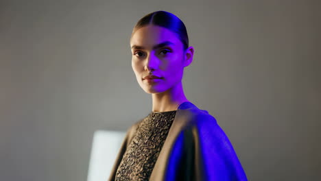 portrait of a woman with dramatic purple and blue lighting