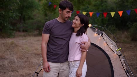 couple camping at dusk