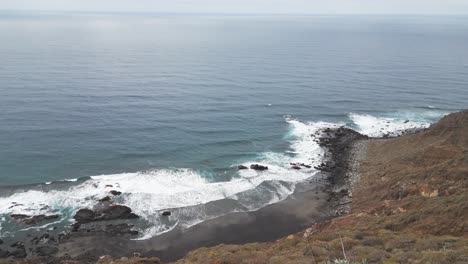 Stunning-isolated-house-on-the-cliff-over-a-black-sand-beach