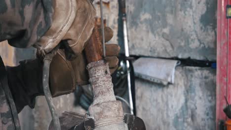 welding a rusty metal pipe