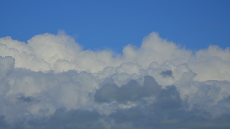 Layered billowing clouds moving across frame