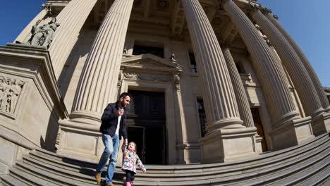 father and daughter at historical building