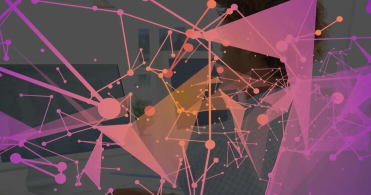 Man sitting desk computer starting pink triangular network mapping data obscuring revealing face