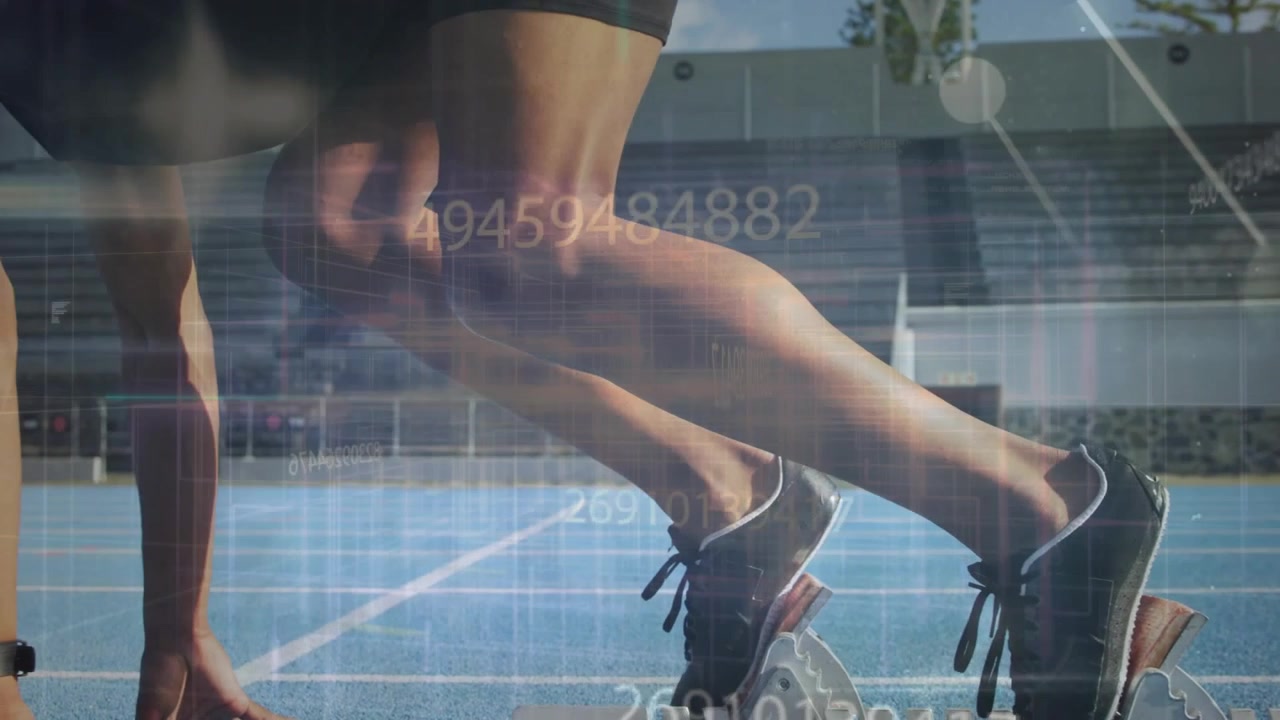 Sprinter shifting weight driving off blocks while numeric overlaying blue track for sports start